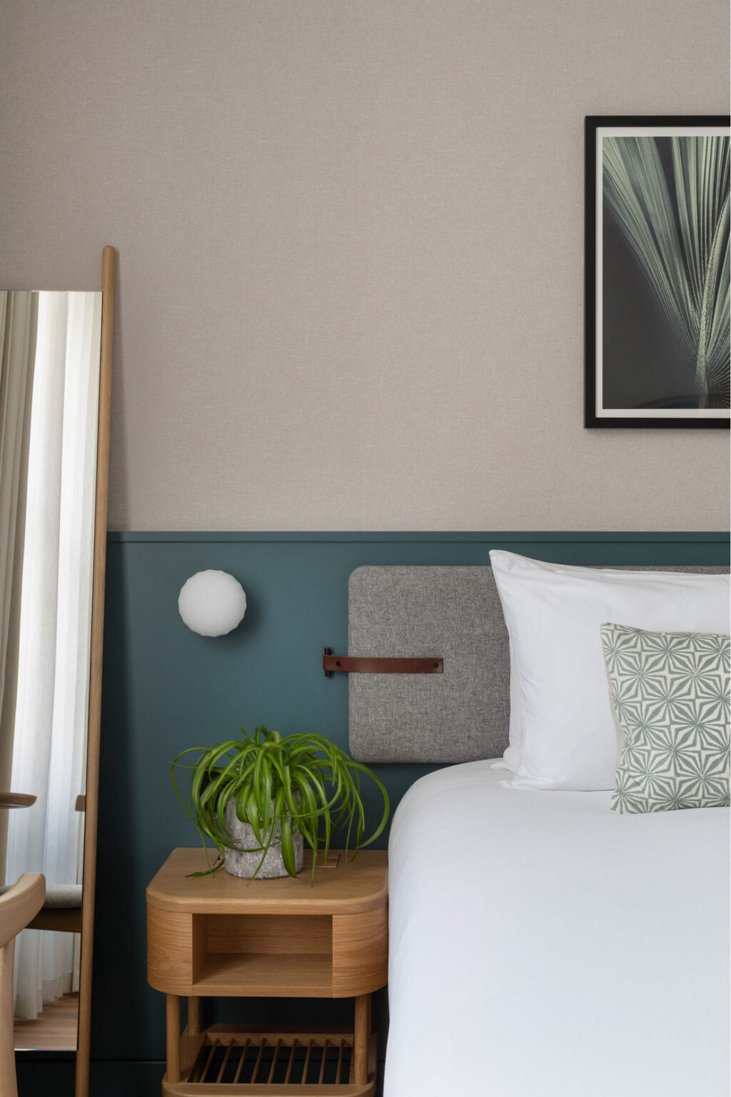 inhabit hotel bedroom with green and plant accents