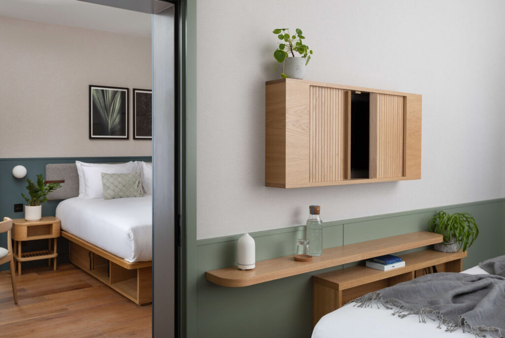 hotel bedroom with green walls