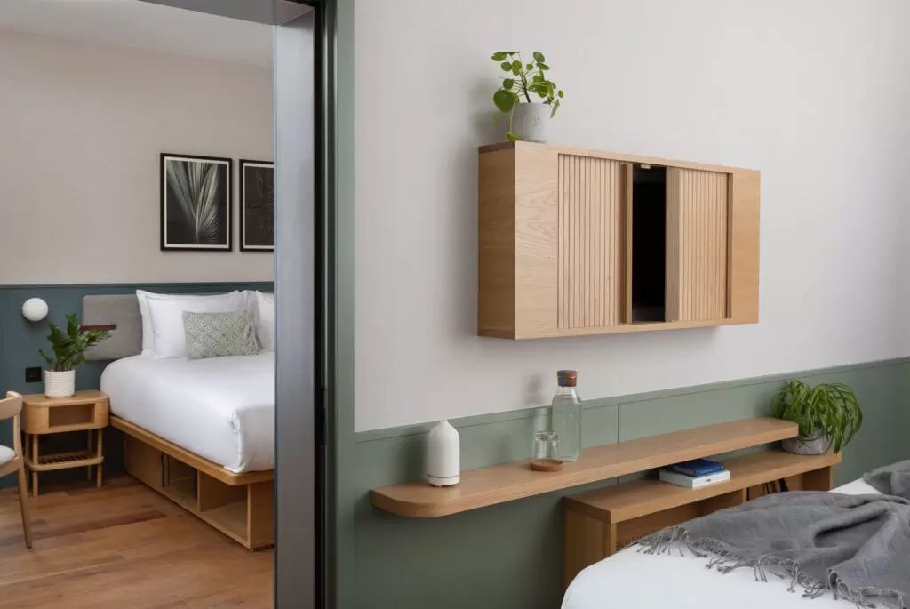hotel bedroom with green walls