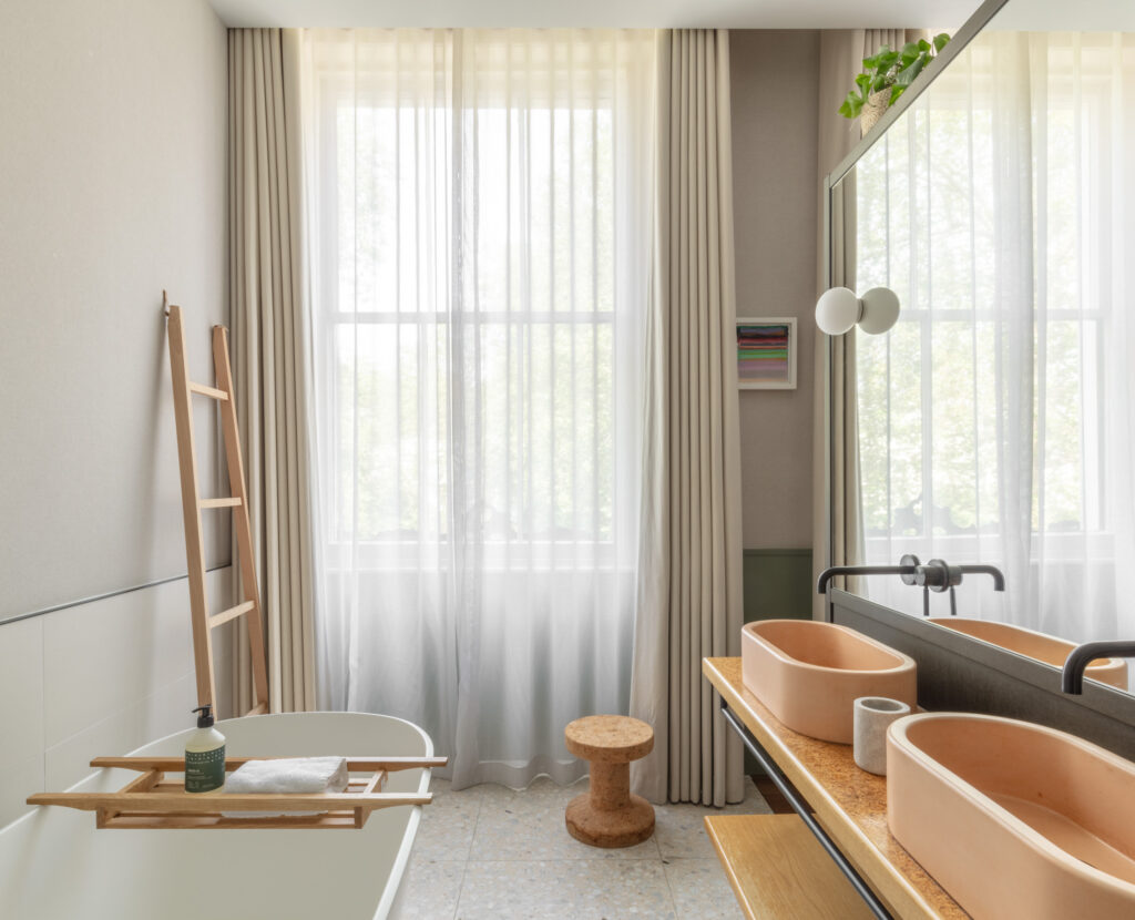 inhabit hotel bathroom with peach sinks